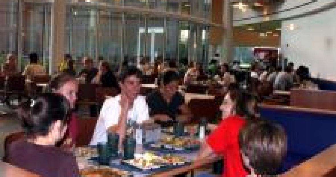 With dinner finished, students chat over their empty dining hall trays