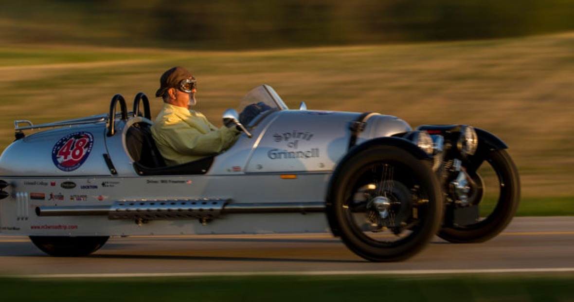 Professor Freeman driving in the ‘Spirit of Grinnell’