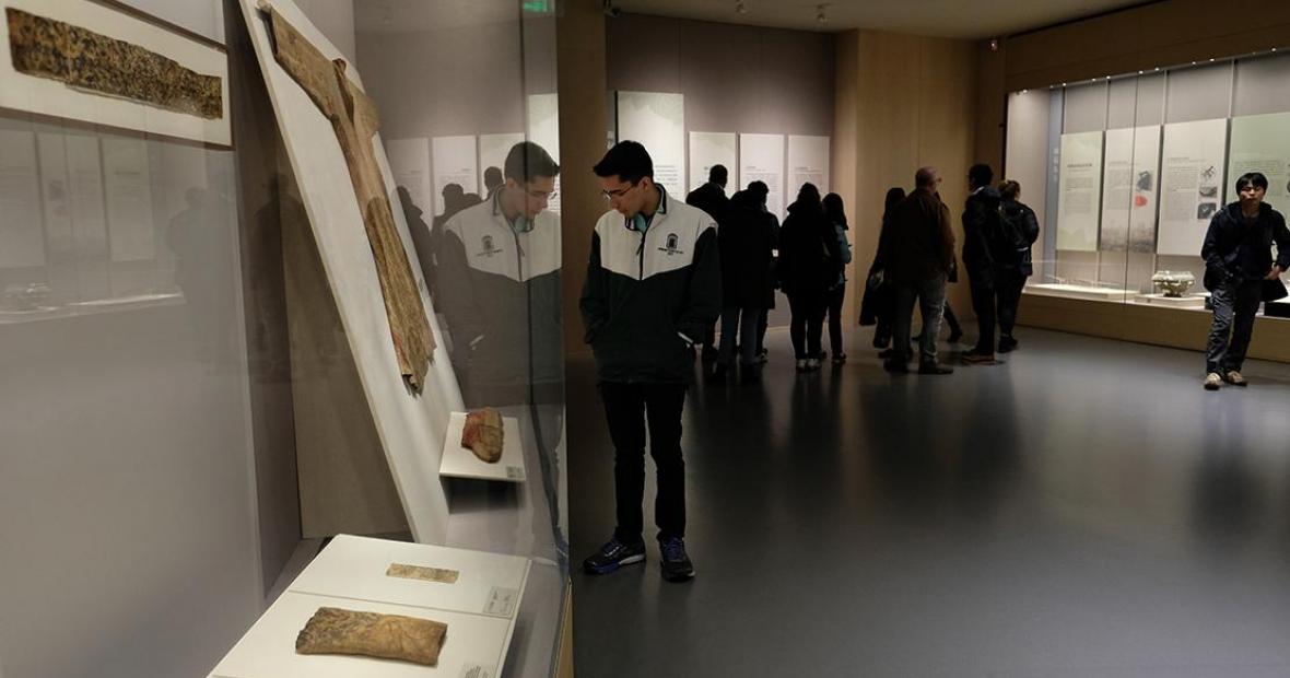 Museum visitors peruse the exhibits