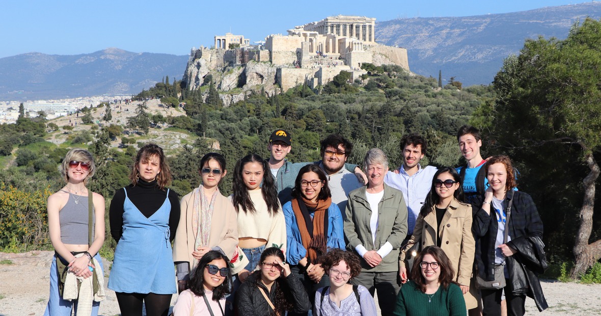Students and Professor Monessa Cummins with the Athenian Acropolis behind them