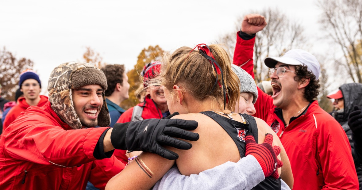 2 people hugging after cross country race
