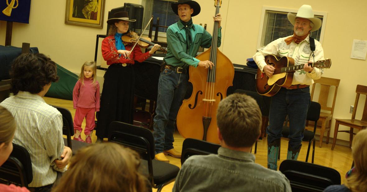 The Double D Wranglers—(from left) Charity Gudgel , Chris Gudgel, and Paul Siebert—demonstrate cowboy yodeling at the yodeling workshop on Nov. 13, 2009.