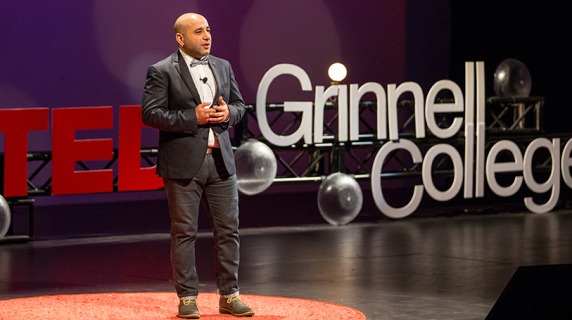 A speaker gives a TEDxGrinnellCollege talk.