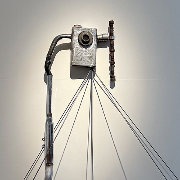 Sculpture by Kay Sniff, "It spoke by itself.", composed of steel and automotive parts.