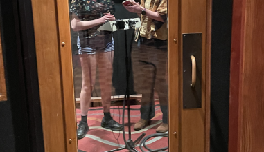 Hayley Carson, left, and Emma Schaefer recording their original song in the studio.