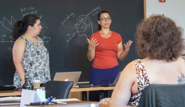Backous and Ferraro teach a class; on the right side, there is a faculty member seated.