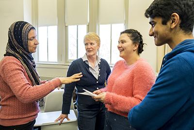 Mervat Youssef, Michele Regenold ’89,  Sarah Cannon ’19, and Ankit Pandey ’20 discuss the class assignment