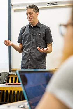 Ross Haenfler standing in front of a class