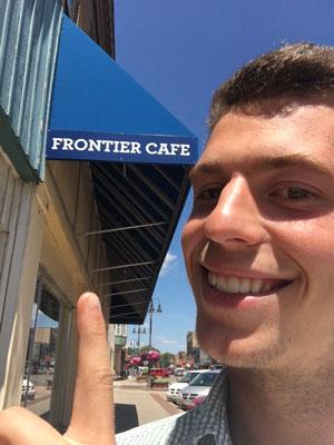 Henry Bolster points out the bright blue Frontier Cafe awning