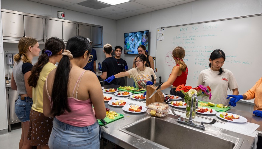 Students in Todd Armstrong's Food Stories First-Year Tutorial got right to work in the Marcus Family Global Kitchen. 