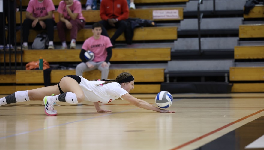 Volleyball player reaching for ball