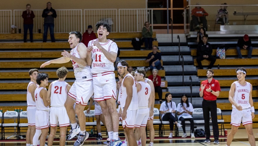 Grinnell Basketball Players Celebrate on Court