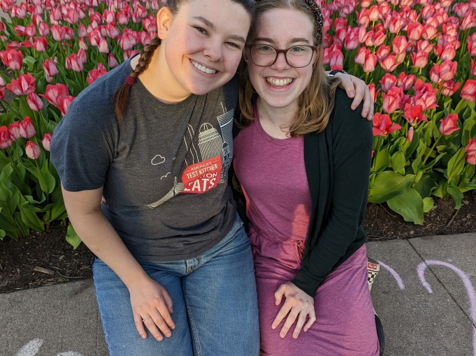 My friend and I sitting in front of the tulips at the Tulip Festival