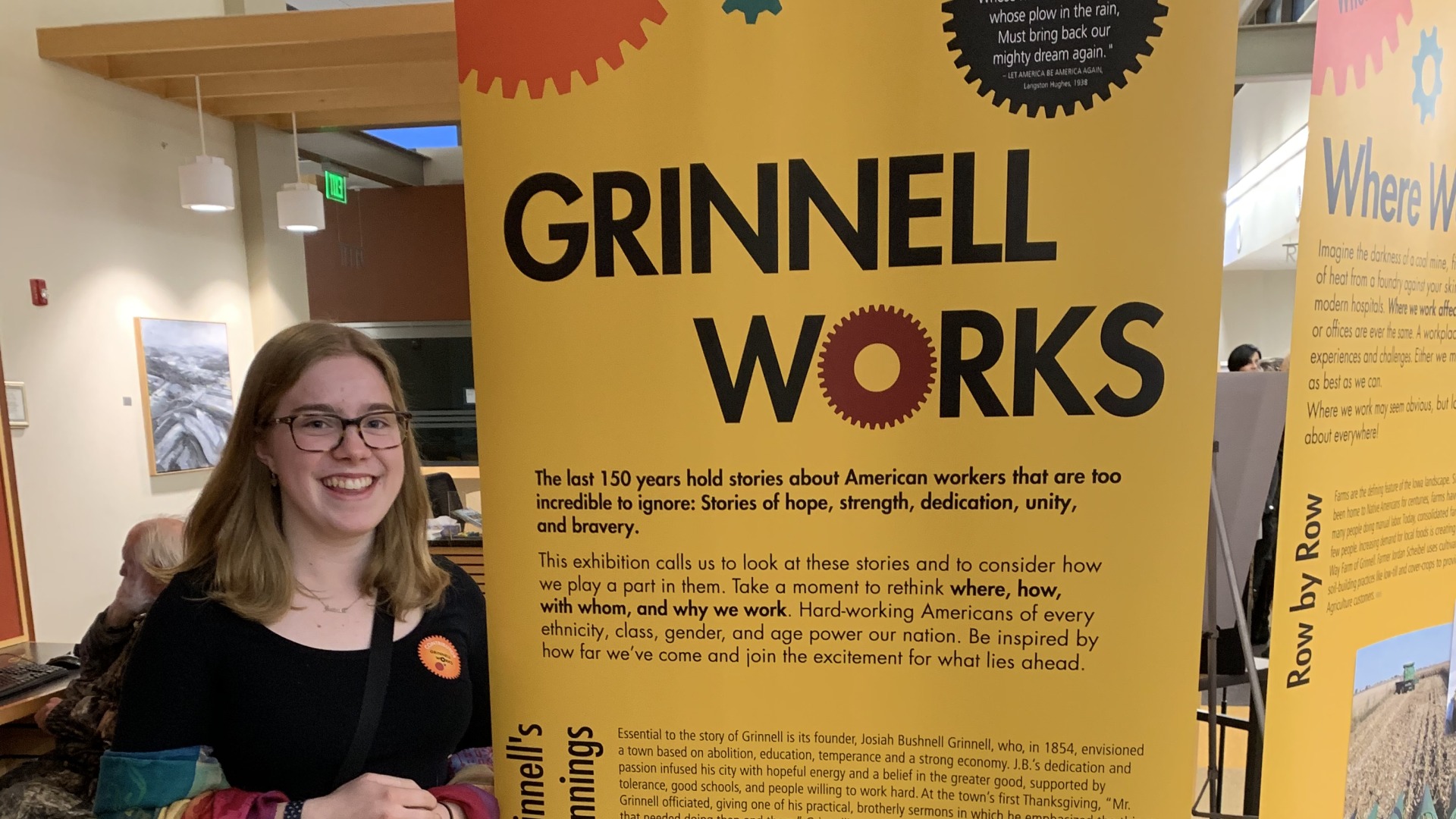 Me standing next to the Grinnell Works Exhibition in collaboration with the Smithsonian Institution