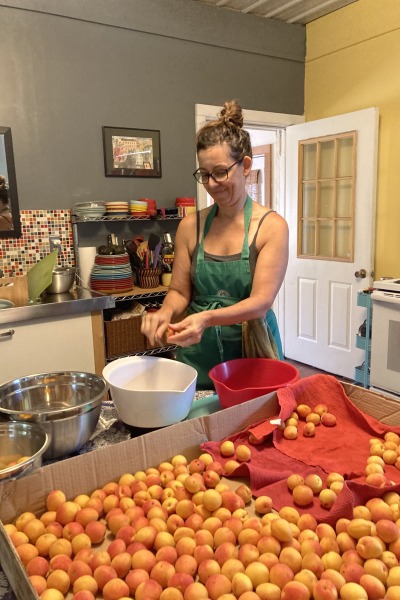 Belinda Backous processing apricots