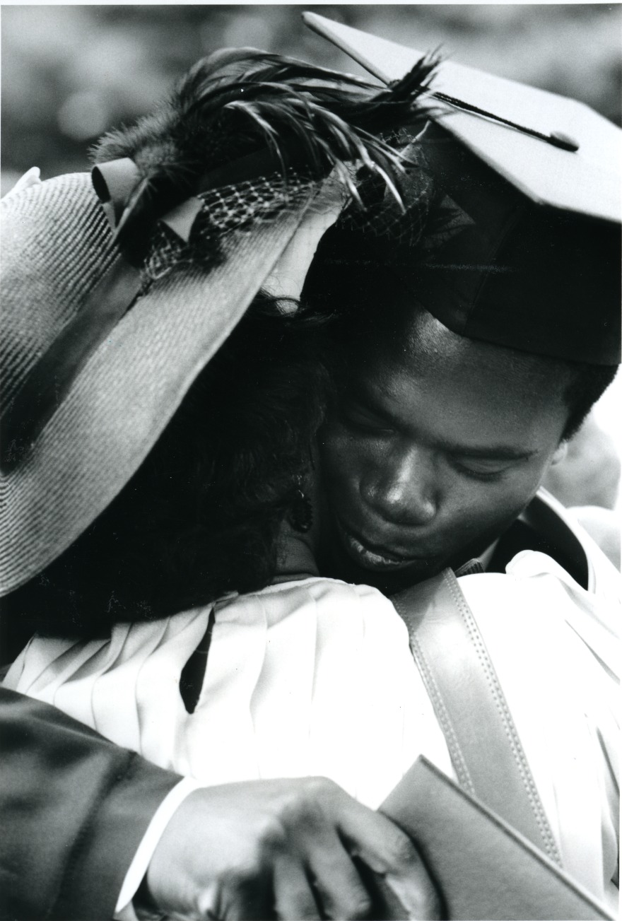 Todd Coulter (class of 1986) receives a hug at the 1986 Commencement. The photo was featured in the Grinnell Magazine, Summer 1986 edition.