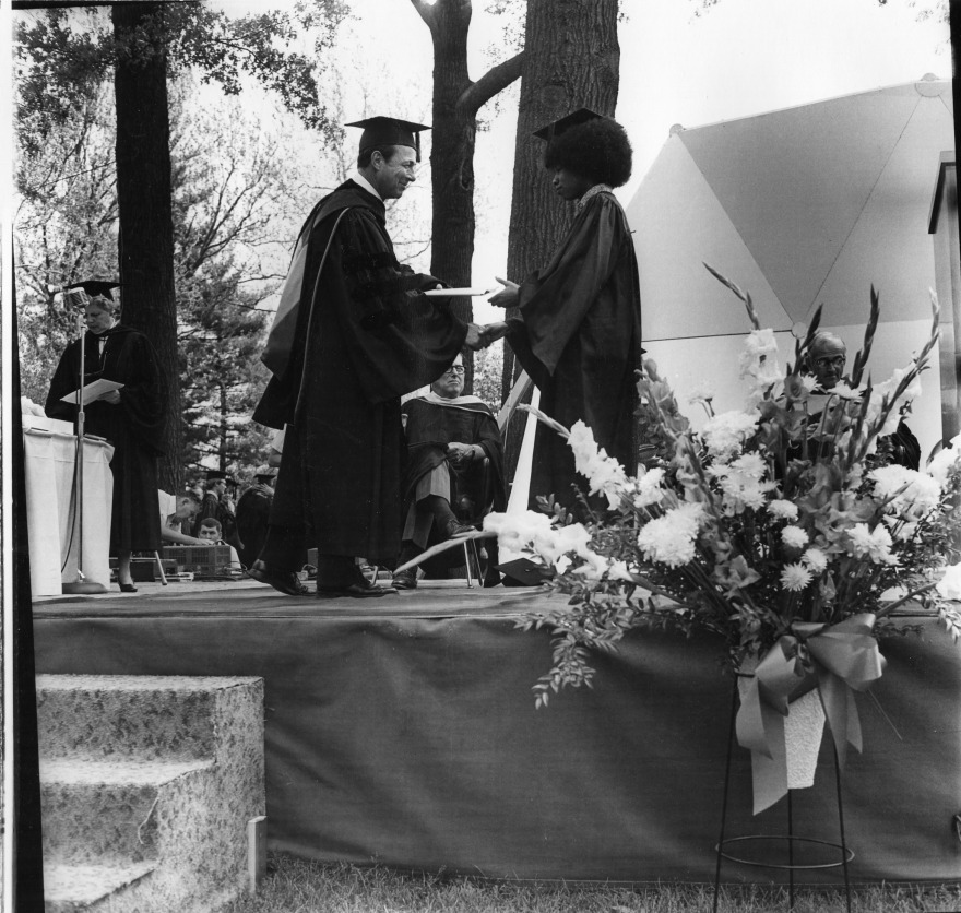 A student presented with their diploma at the 1972 Commencement. Courtesy of Grinnell College Special Collections & Archives. 