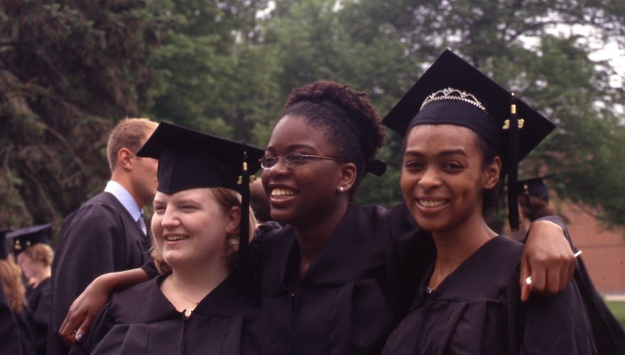 Students pose for a photo at the 2003 commencement ceremony. Courtesy of Grinnell College Special Collections & Archives. 
