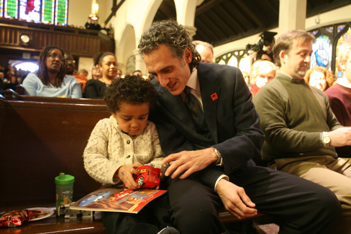 Peter and Emerson playing quietly with toys in pew