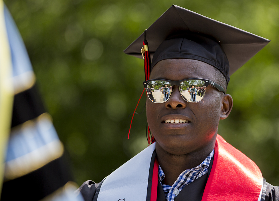 Shaun Mataire in mortar board and sunglasses