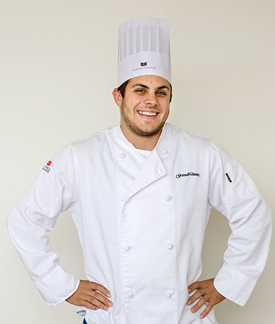 Eric Mistry '14 in chef's outfit
