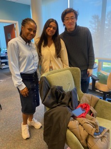 3 student leaders from student government smile in the FGLI lounge