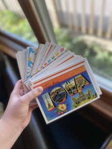 a stack of postcards read "Greetings from Iowa"