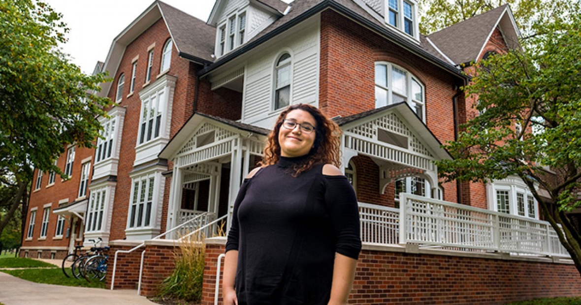 Lizeth Gutierrez ’12 in front of Mears Cottage