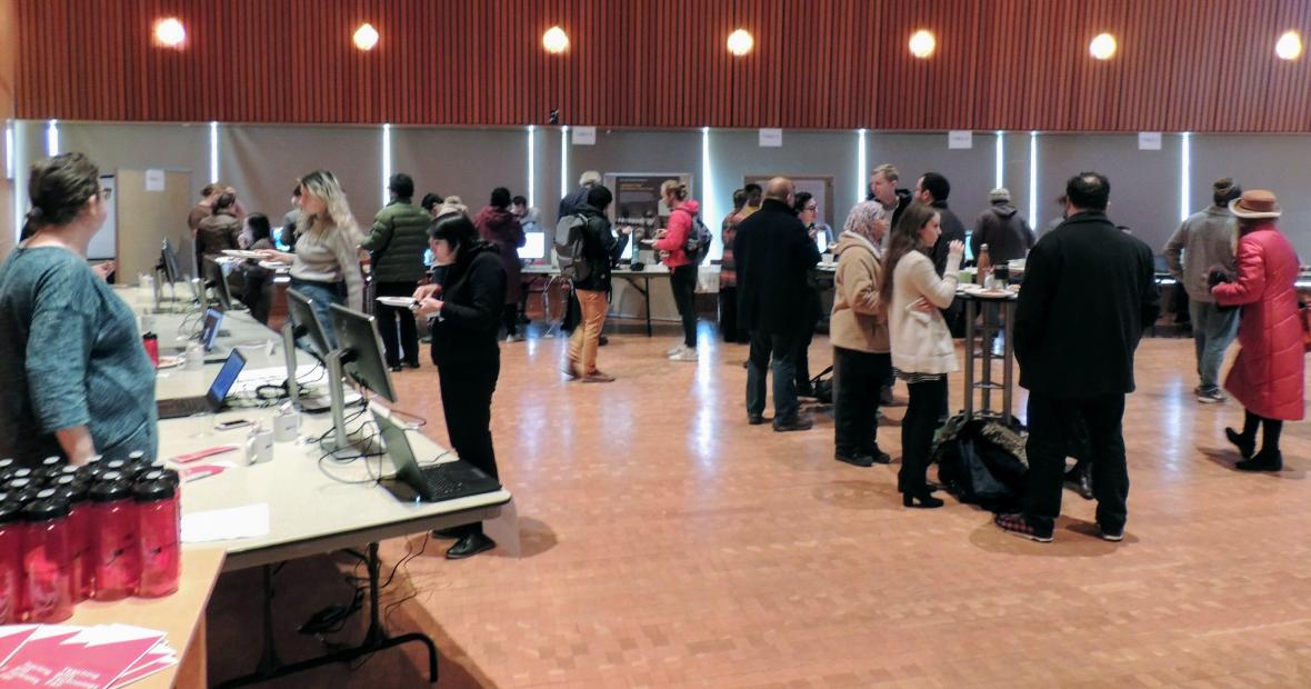 Attendees sample the various exhibits at the Digital Liberal Arts Fair