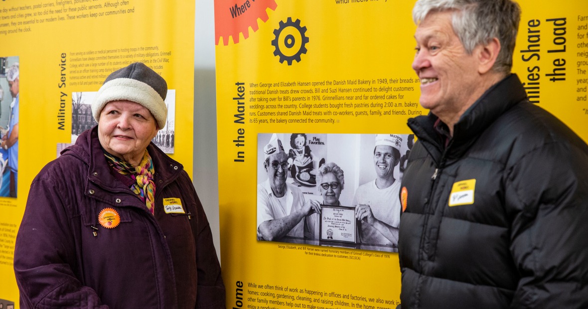 Bill and Suzie Hansen standing by a photo of Hansen's Bakery in the exhibit