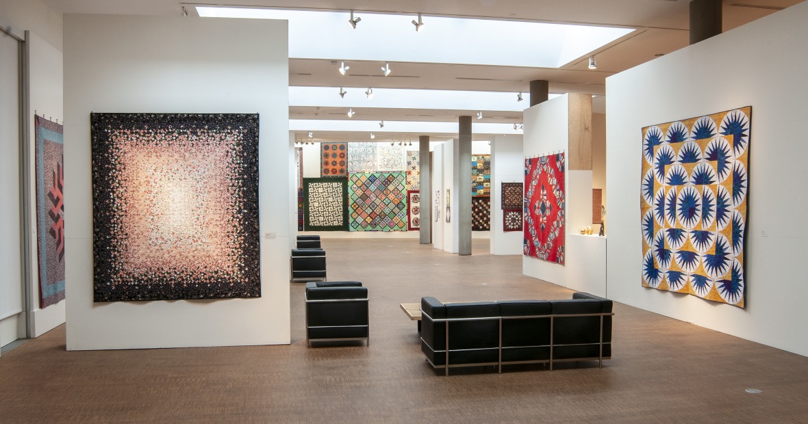 bright quilts on display in Faulconer Gallery, Grinnell Museum of Art