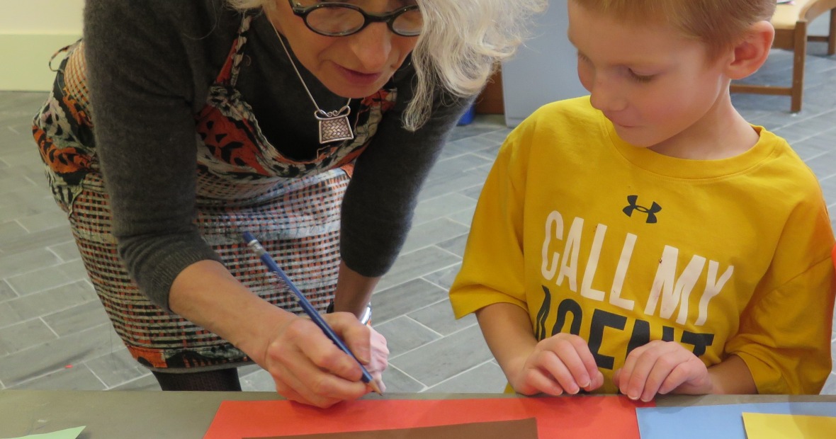 Tilly Woodward doing art with preschool student