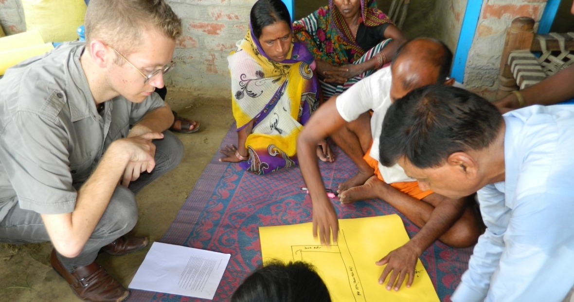 Anthony Wenndt in discussion with farmers in India