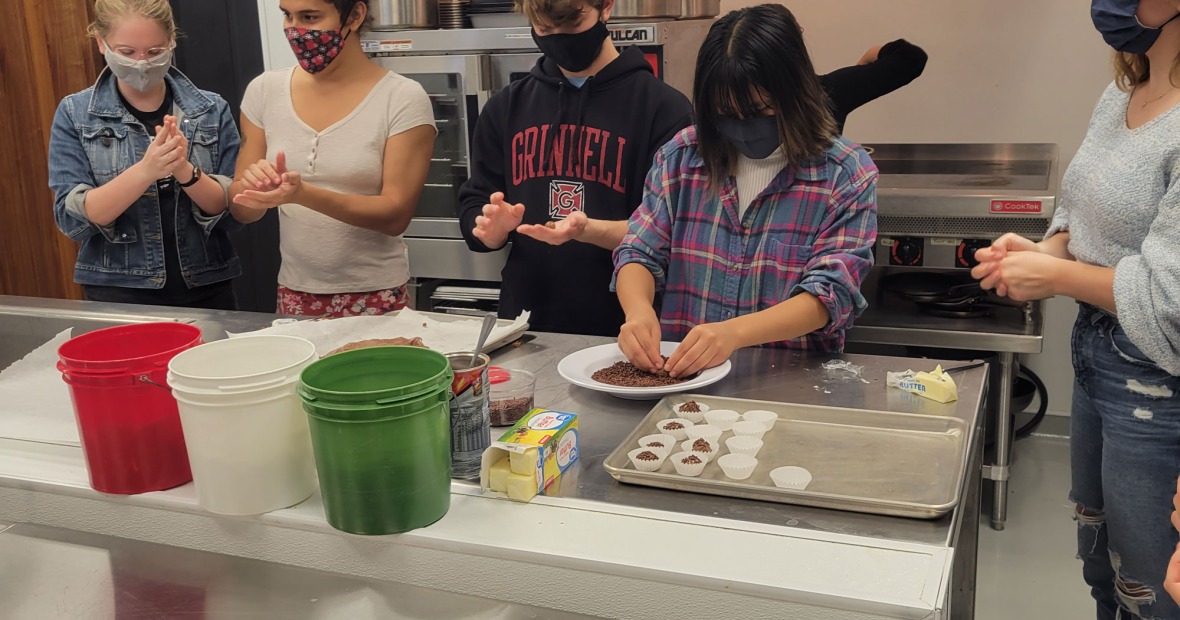Group of students making food at the global kitchen