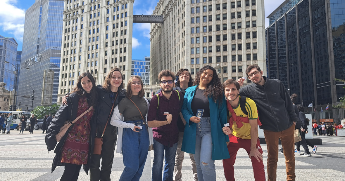 8 Brazilian students in Chicago holding their passports and cards