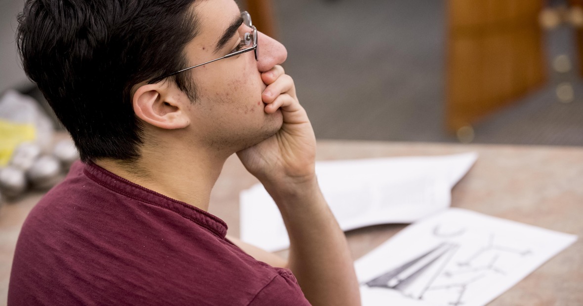 A student listens thoughtfully in a philosophy class