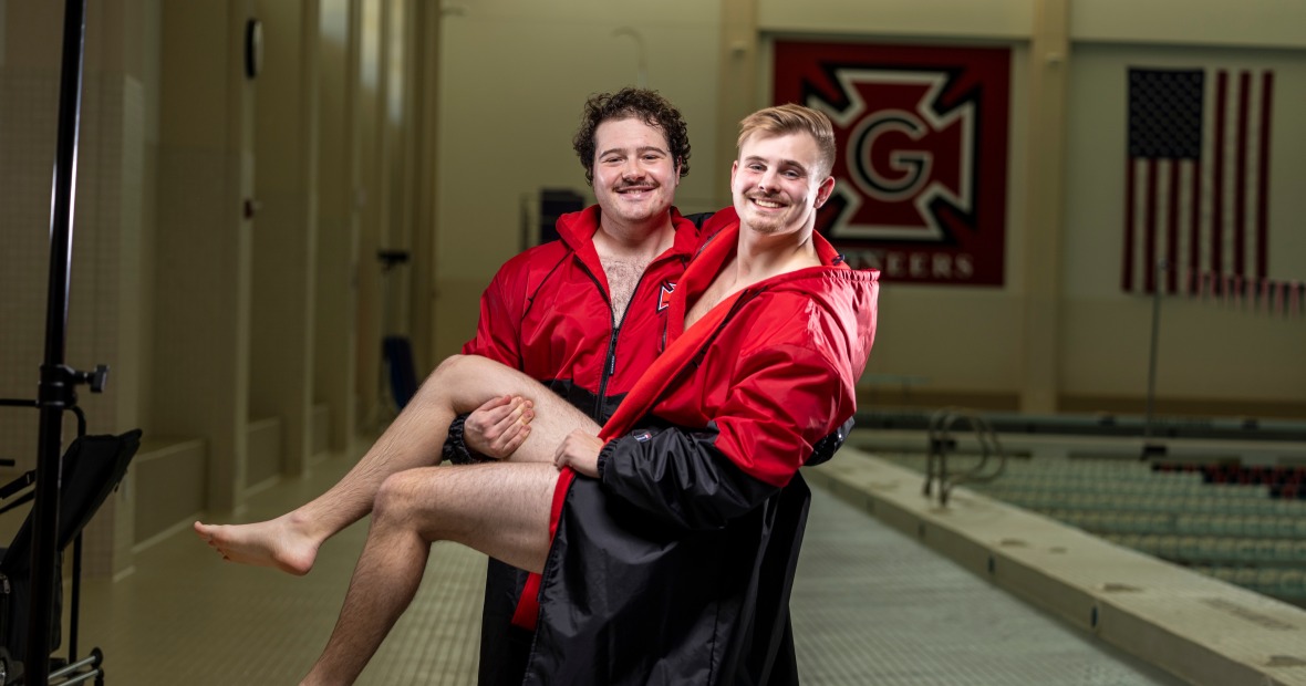 Me held up by my best friend Quinn near a Grinnell indoor swimming pool