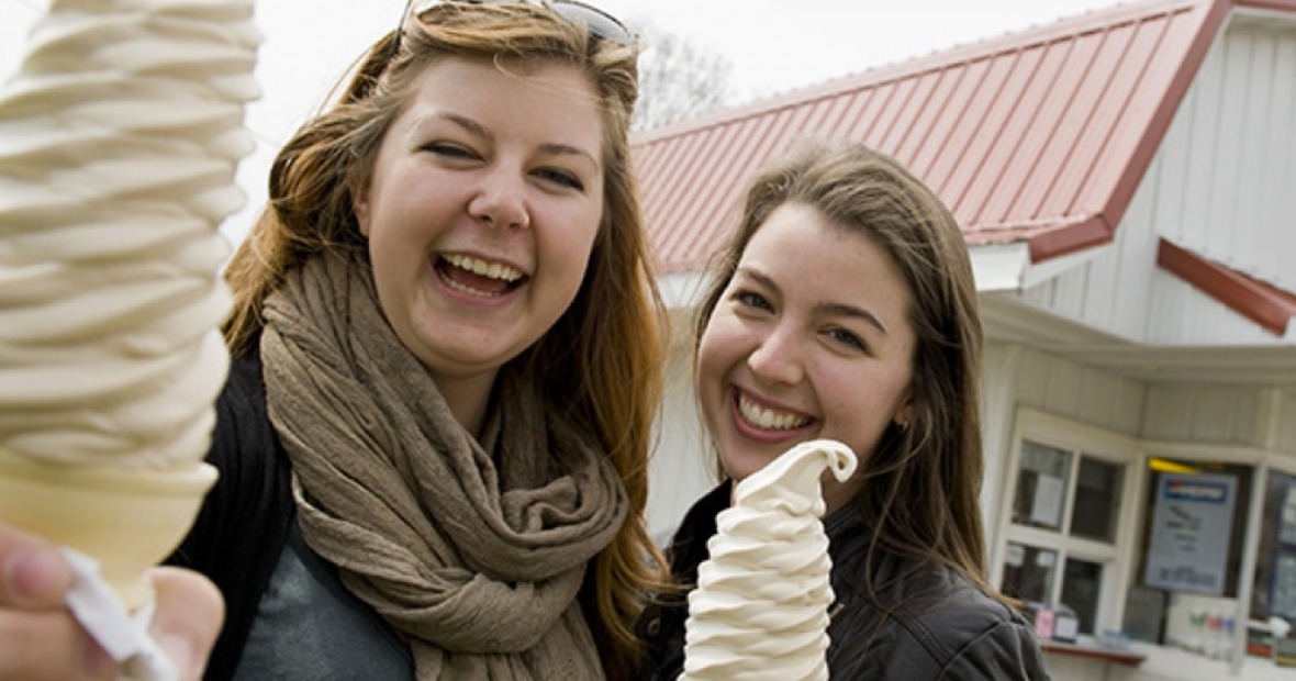 Two students hold ice cream cones at Dari Barn