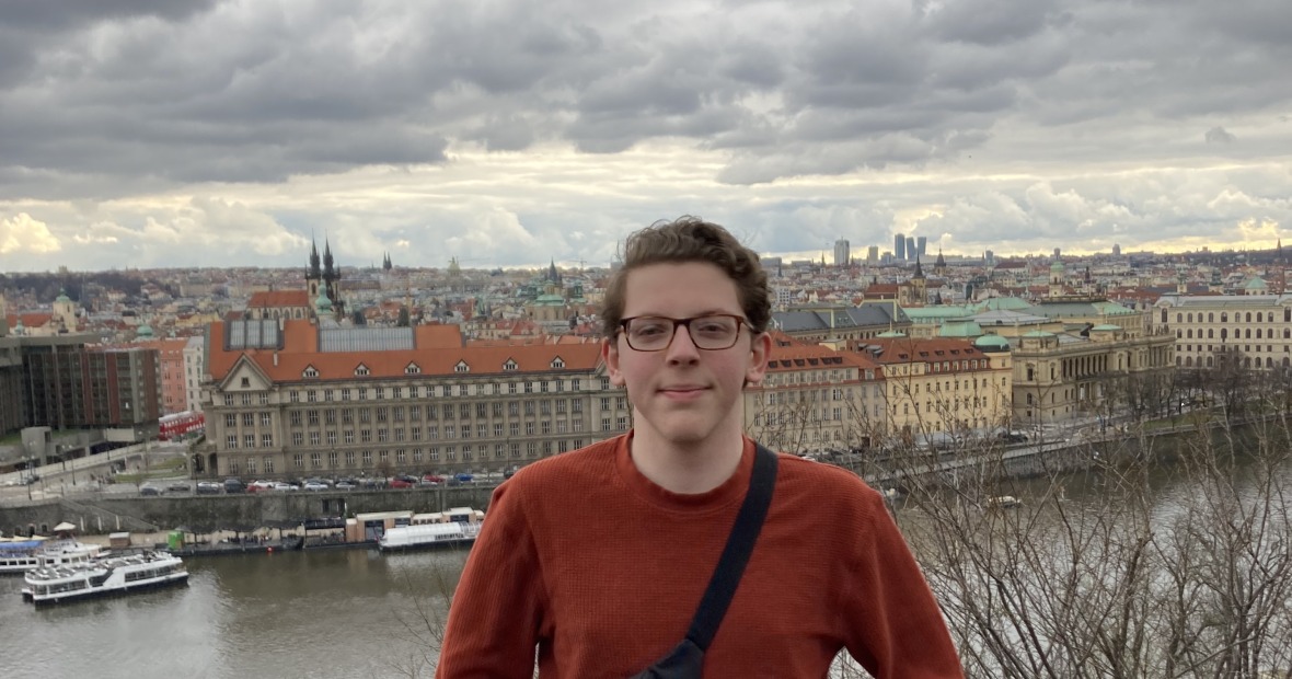 I stand proudly in Prague, next to a river.