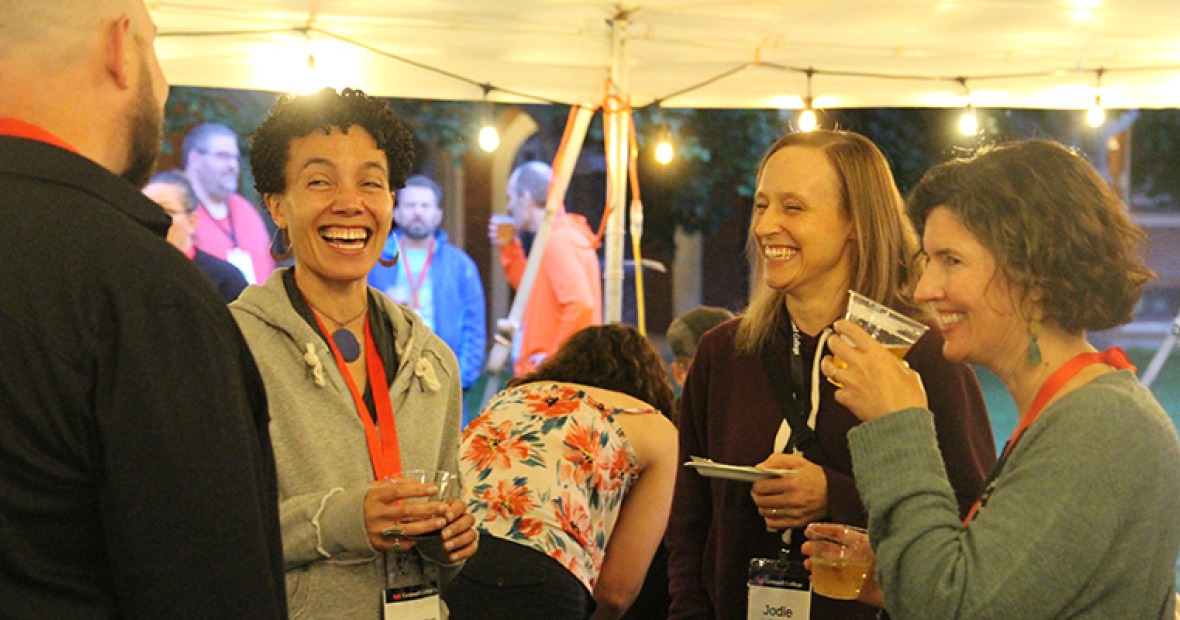 A group of alumni laugh as they enjoy the 2025 Reunion festivities.