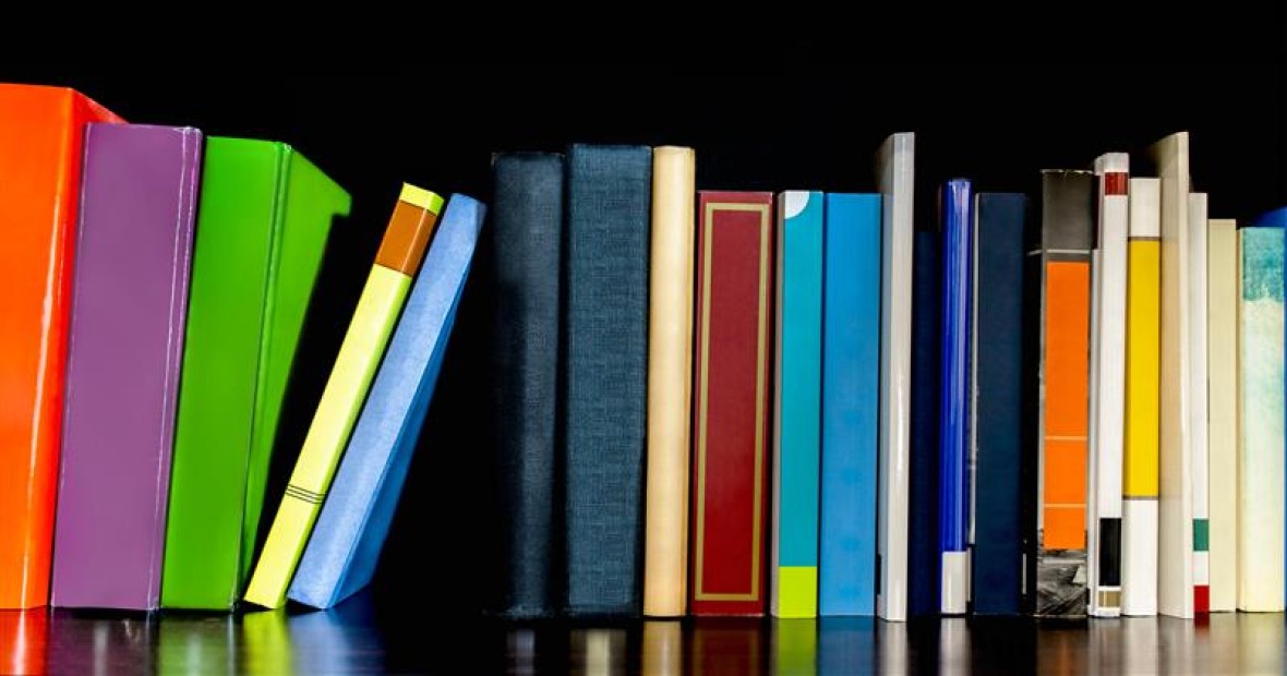An illustraction of a shelf of colorful books of different sizes and shapes.