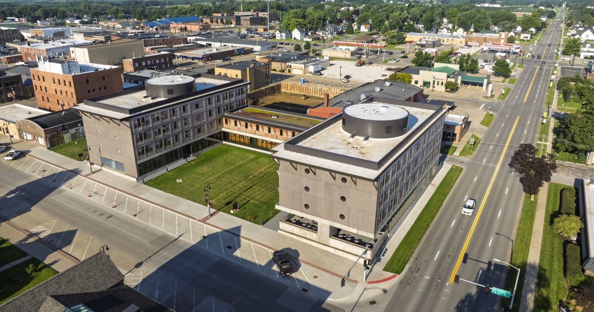 drone shot of Grinnell with blue sky and highway