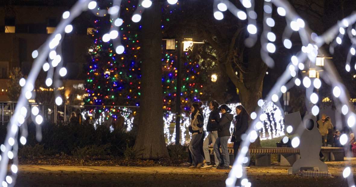 Christmas lights and people walking