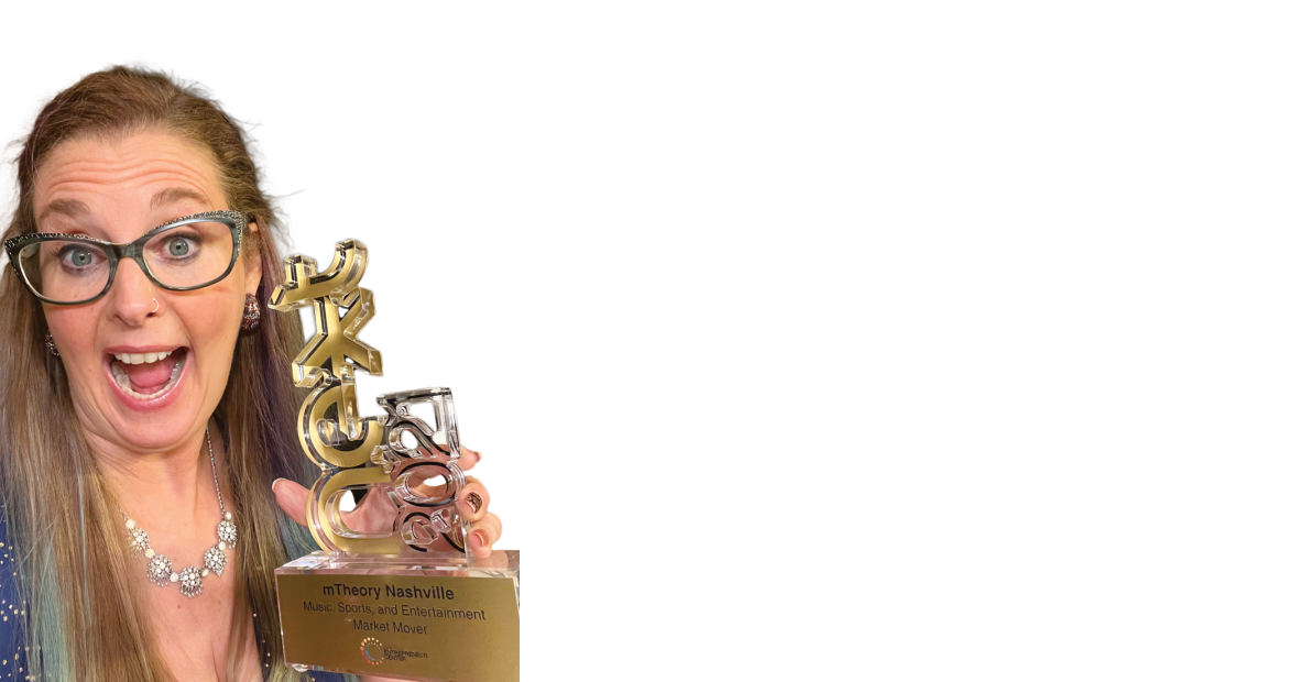 Cameo Carlson holds an award