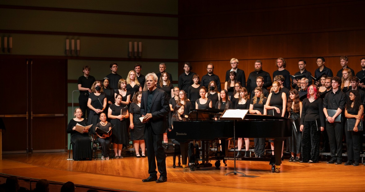 Grinnell Singers Performing on stage wearing all black 