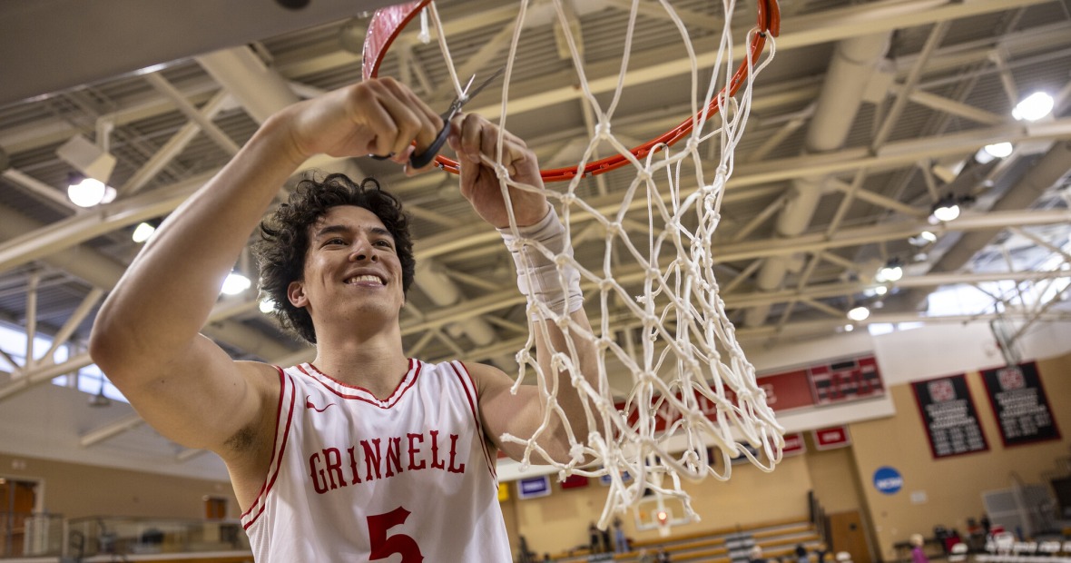 basketball player cutting net