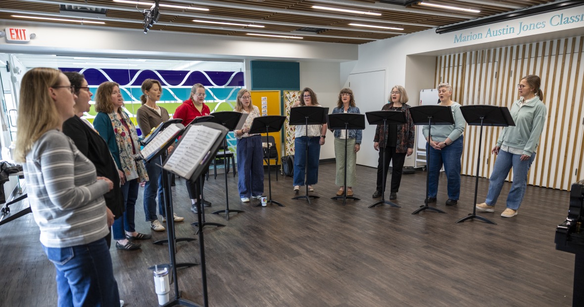 Group of Women Singing in a circle 