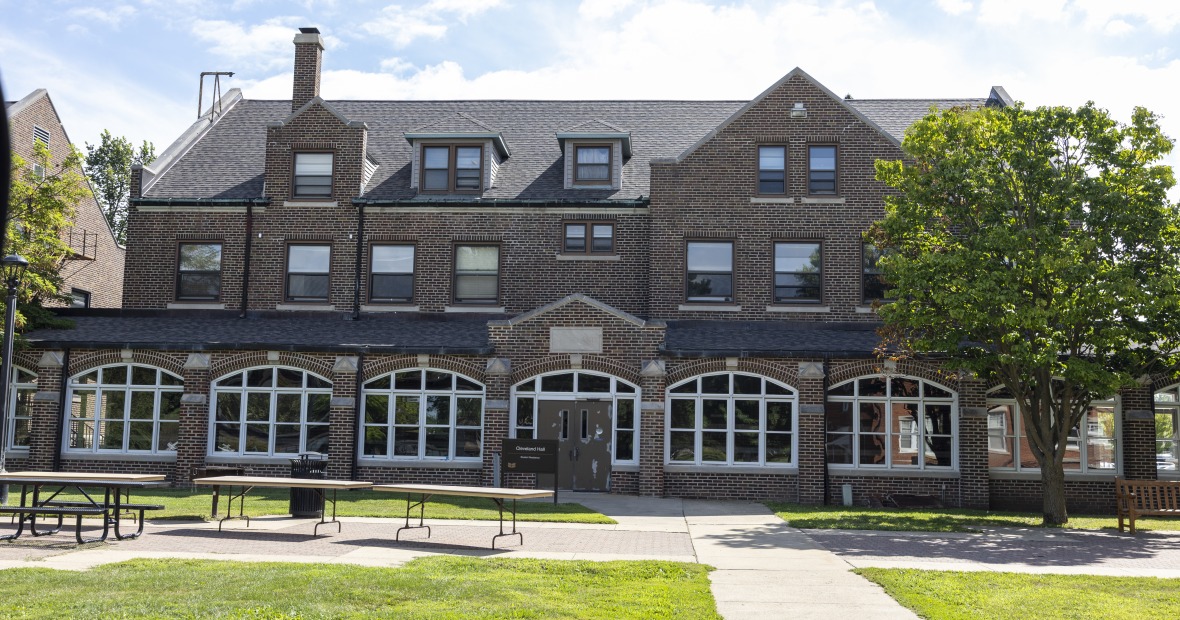 Cleveland Hall is a three-story brick building.