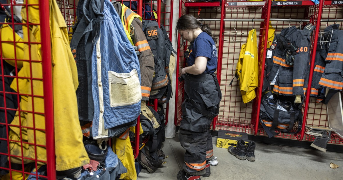 girl putting on fire suit