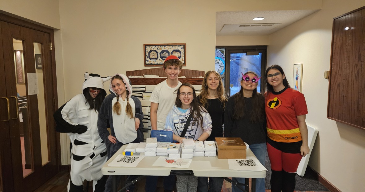 Marissa Goffman '24 with students during a Purim fundraiser for a local nonprofit.